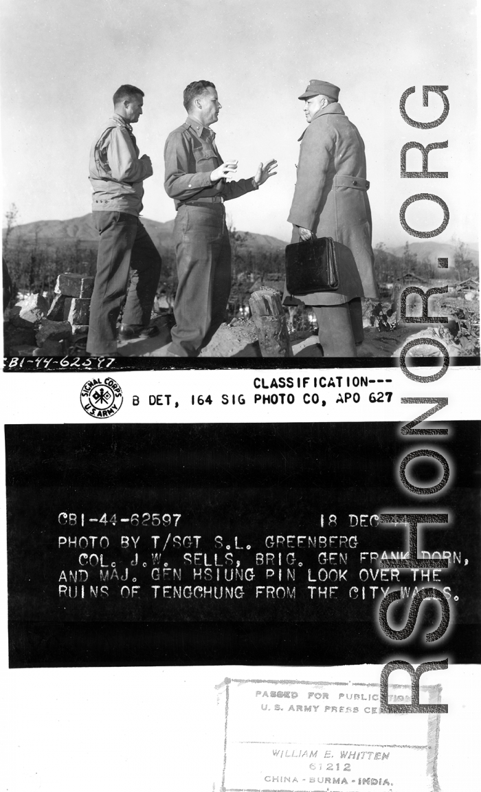Col. J.W. Sells, Brig Gen. Frank Dorn, and Maj. Gen. Hsiung Pin look over the ruins of Tengchong from the city walls.  December 18, 1944.  Photo by T/Sgt. S. L. Greenberg. 164th Signal Photographic Company.  Passed by William E. Whitten.