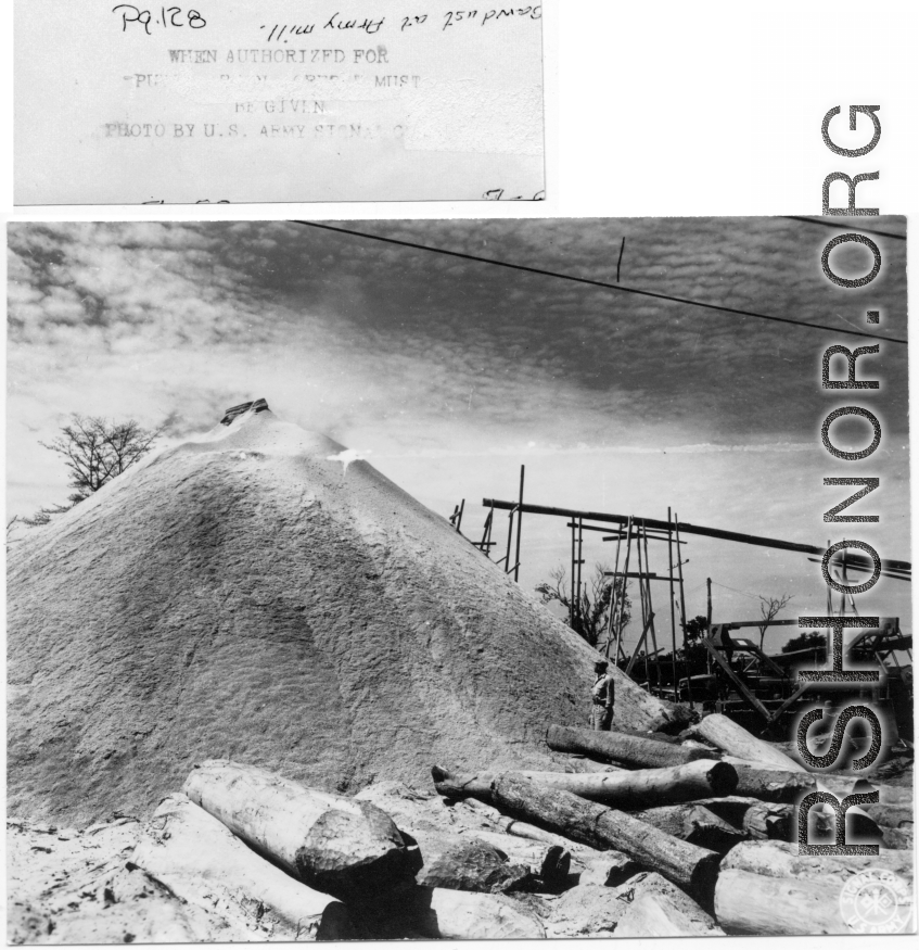 Saw dust pile at Army lumber mill during WWII in the CBI.