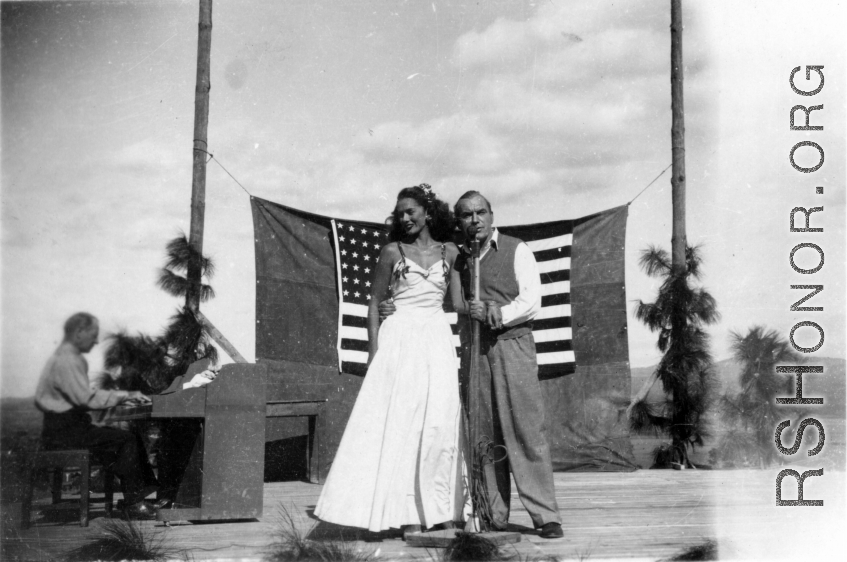 Pat O'Brien's USO troupe performs at an American airbase in China in October 1944--Here  Pat O'Brien and Jinx Falkenburg perform.