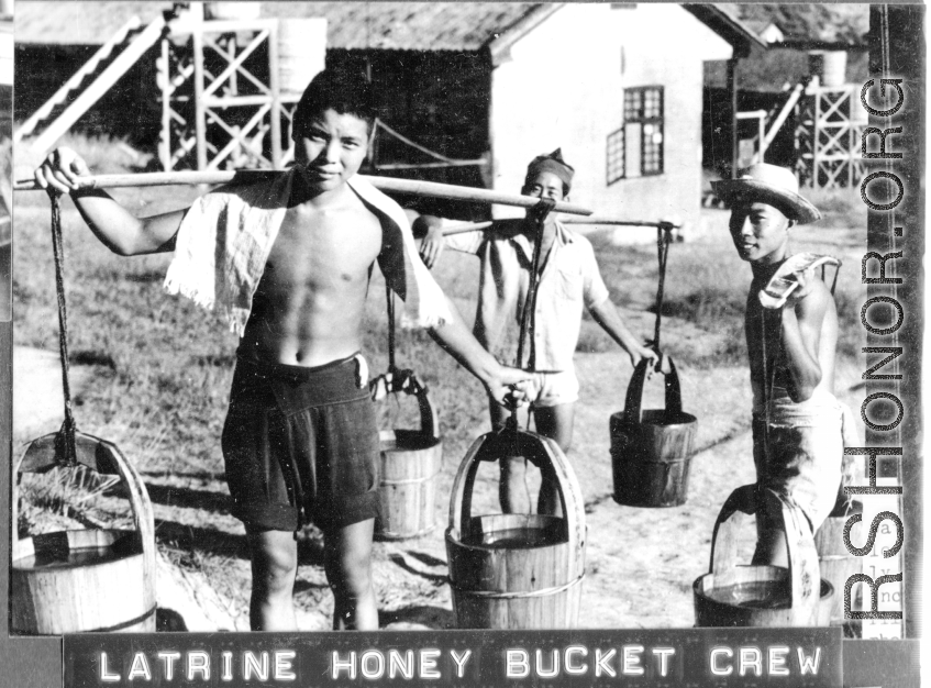 Latrine honey bucket crew at work at Chanyi (Zhanyi), during WWII.