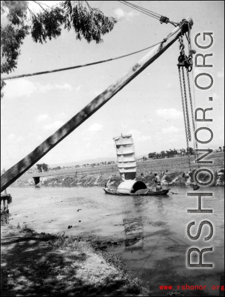 Boat on a canal in Yunnan province, China, during WWII.