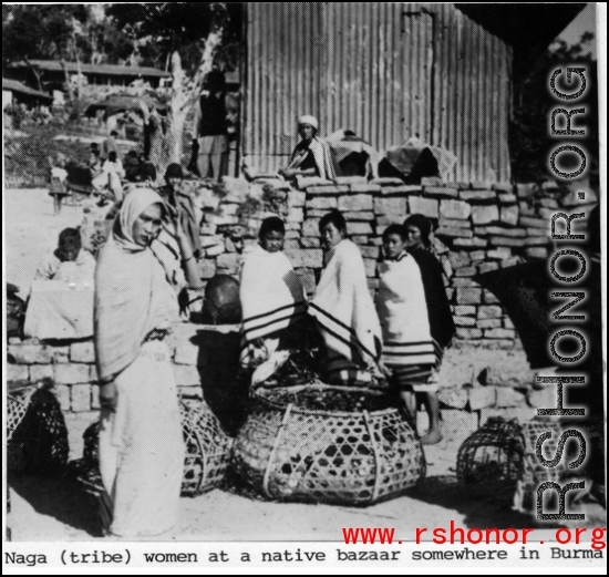 Naga tribe women at a native bazaar in Burma. In the CBI.