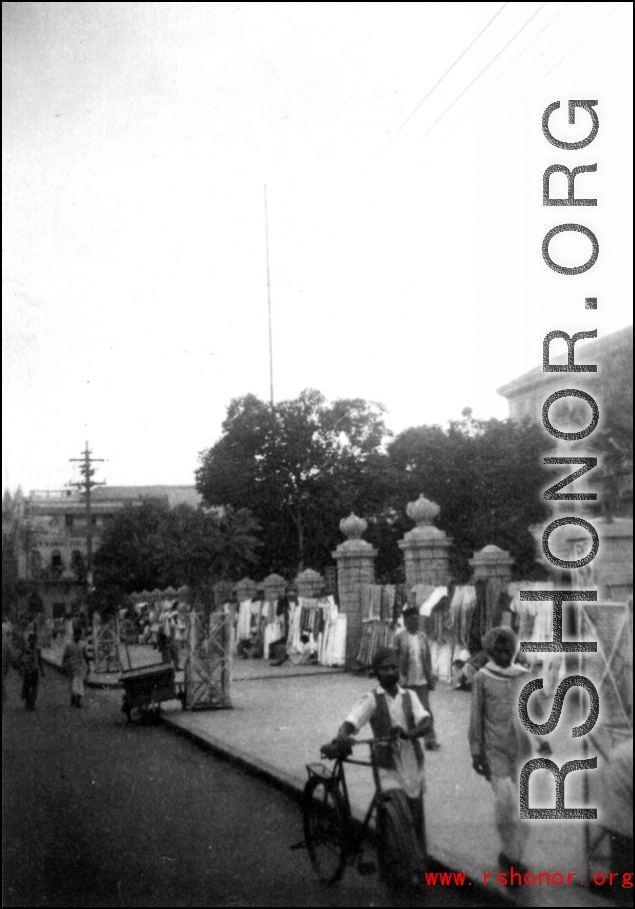 Street scene, with cloth sellers in Karachi, India 1942.