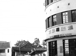Local people in in Kunming city, Yunnan province, China: A market area and the "Hunan Embroidery Store" during WWII.