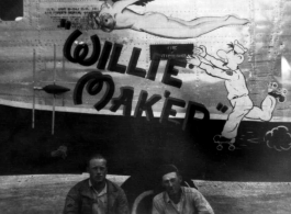 Two US servicemen pose in front of the B-24 "Willie Mak'er".  From the collection of Robert H. Zolbe.