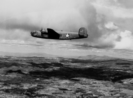 B-24 China Beauty (中国美人), tail #240367, in flight in the CBI.
