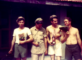 American flyers goof in front of barracks in China.