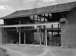 A house under construction in a village in Yunnan province, China. During WWII.