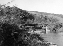 A covered pedestrian bridge in Yunnan province, China. During WWII.
