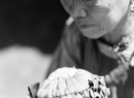 Local people in China: An elderly woman and infant. During WWII.