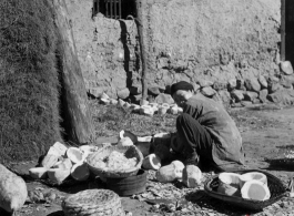 Local people in China: A village woman cleaning melons.