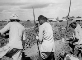 Local laborers dig in India during WWII.