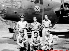 Crew standing before a B-25 bomber. In the CBI during WWII.