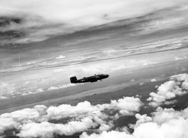 B-25 Mitchell bombers dropping bombs in flight in the CBI, in the area of southern China, Indochina, or Burma.