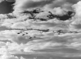 B-25 Mitchell bombers in flight in the CBI near an American air base, in the area of southern China, Indochina, or Burma. During WWII.