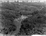 IOGU 5M20 7 2ND T.C. AIR SUPPLY SEC. Parachutes plaster a small area of open rice paddy.