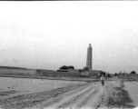 A man bicycles on dusty road near the Chengtian Temple Pagoda in Yinchuan, in northern China, during WWII.   二战期间银川的承天寺塔。