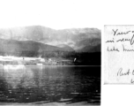 Camp Schiel rest camp in China during WWII, viewed from across the lake, taken from a small rubber raft raft or small recreational boat. March 1945.