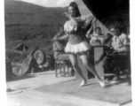 A woman dances for the troops in the CBI during WWII.