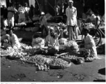 An open-air produce market in India or Burma, during WWII.  Photo from Glenn S. Hensley.