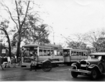 Scene on the road in Calcutta, India (based on the Dhar and Mondal Bros. Machineries" sign on the trolley). In the CBI during WWII.