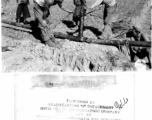 American Army petroleum engineers bend a fuel pipe with a hydraulic jack going through a farming field in SW China while local people look on. During WWII.  Photo by 164th Signal Photographic Company, provided by "Hibbert."