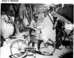 A Chinese postman delivers wartime mail by bicycle, during WWII.  Photo from Jesse D. Newman.