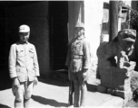 Two very young Chinese soldiers keeping guard in SW China during WWII.