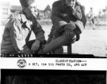 Cpl. Harold C. Brunner interacts with Chinese and child during WWII in China.  Yunnan Province on December 13, 1944.  Photo by T/5 John B. Hendrick.