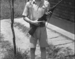 A Chinese soldier poses with an American carbine rifle in northern China during WWII.