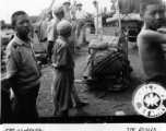 September 27, 1944  During WWII, arms and ammunition wait on the siding at Liuchow as the railhead is jammed with refugees fleeing the Japanese march on Kweilin (Guilin).