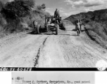 Pvt. Thomas J. Gardner, Georgetown, Ky., road patrol operator of the Burma Road Engineers, grades part of the road west of the Salween River.   Burma, 10/1/1944. During WWII in the CBI.  Signal Corps Photo by Tec 5 C.L. Kocourek.