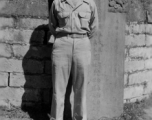"T. T. Hale in front of a Chinese Cemetery"-- The gravestone behind is for the Ni family, erected 1877, during the Qing dynasty (Guangxu period).  In southwest China during WWII。