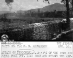 The allied attack on Tengchong (Tengchung) in Yunnan province, China, during WWII, showing the city wall. Note American P-51 in flight.   Photo by F. D. Manwarren.