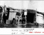 Unique GI accommodations--combination tent and miscellaneous spare parts--at Warazup, Burma. April 1945.